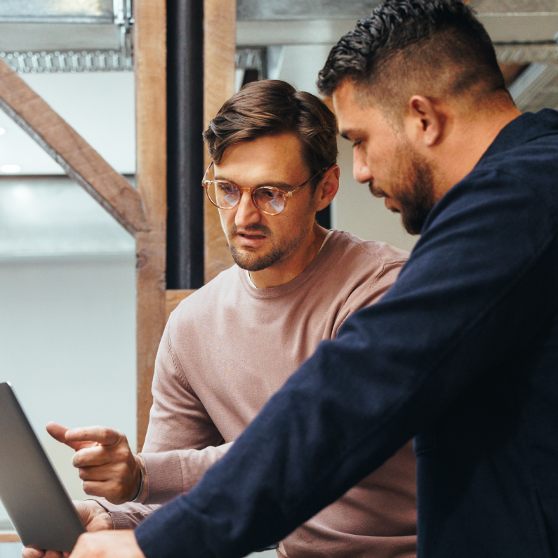 Two Men Discussing Work